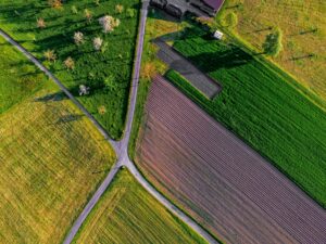 An aerial view of a farm Photo Credit: ricardo-gomez-angel-TbwnUGV4kok-unsplash